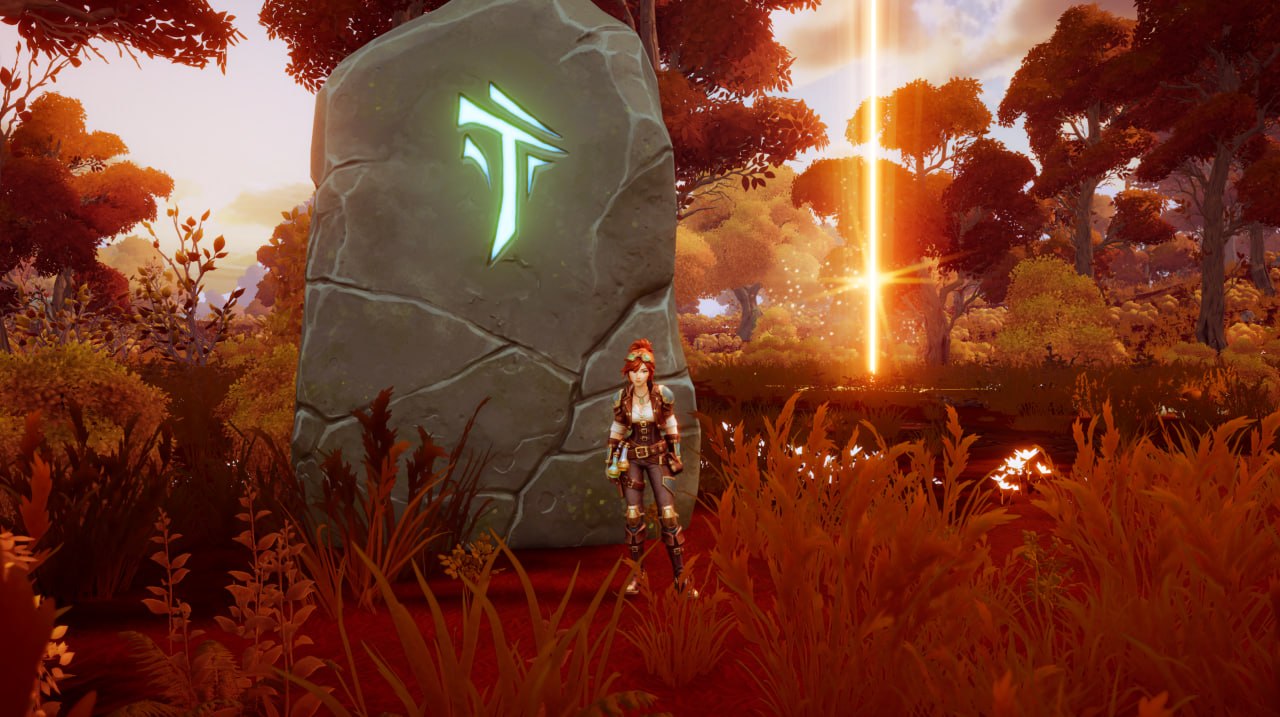 Gemma standing beside a giant rune stone in Where Giants Fall.